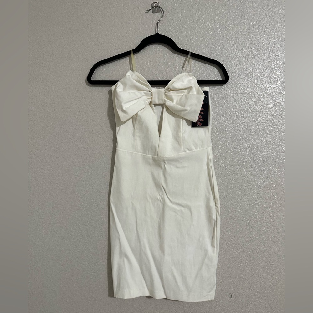 Off white strapless dress with bow.
